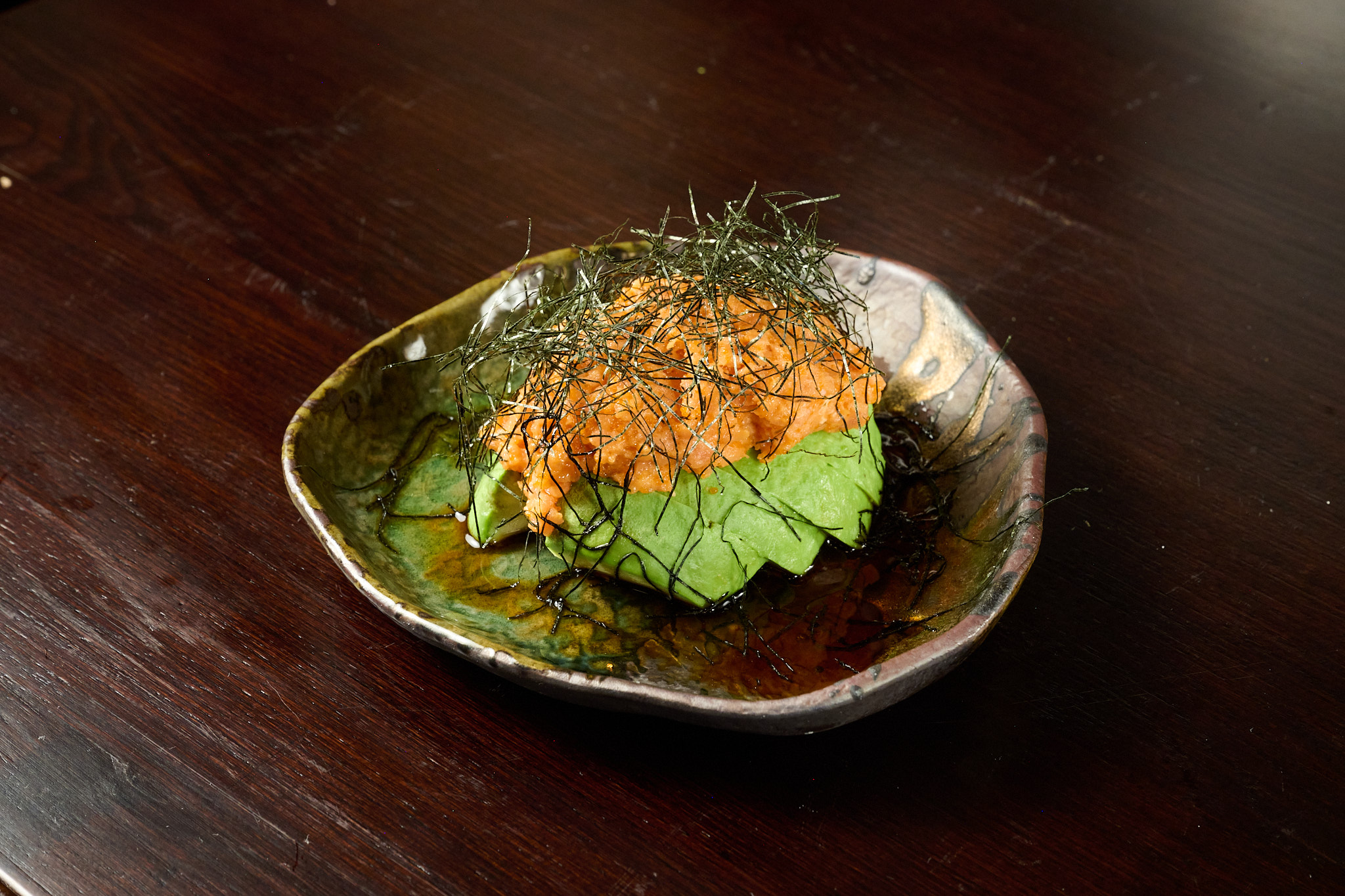 Fresh seasonal fish fillet presented on a shiso leaf at Showa Era Izakaya New York