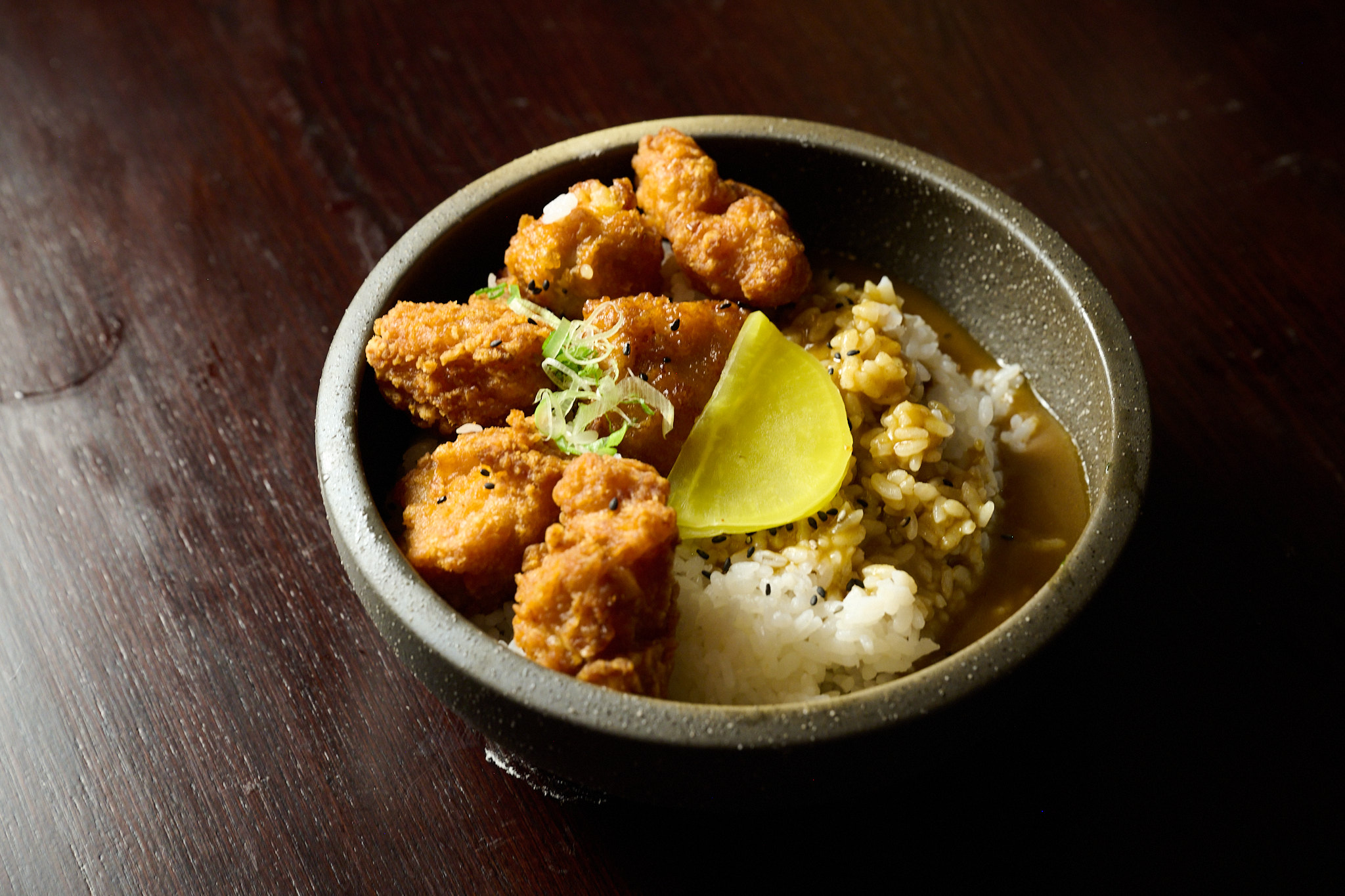 Karaage don rice bowl with crispy fried chicken, rice, and lemon at Showa Era Izakaya NYC