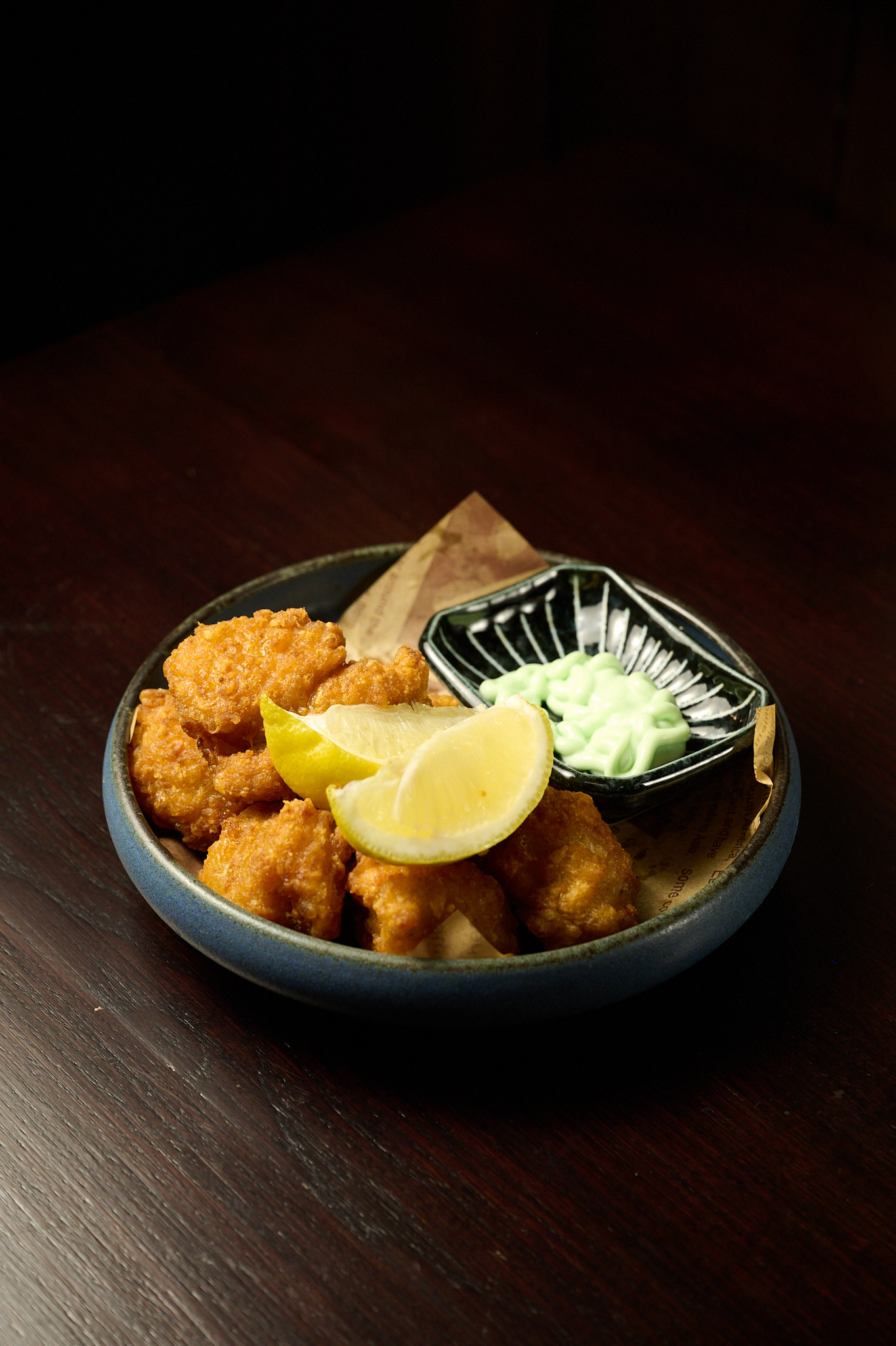 Crispy golden chicken karaage with lemon wedge and wasabi mayo dipping sauce at Showa Era Izakaya