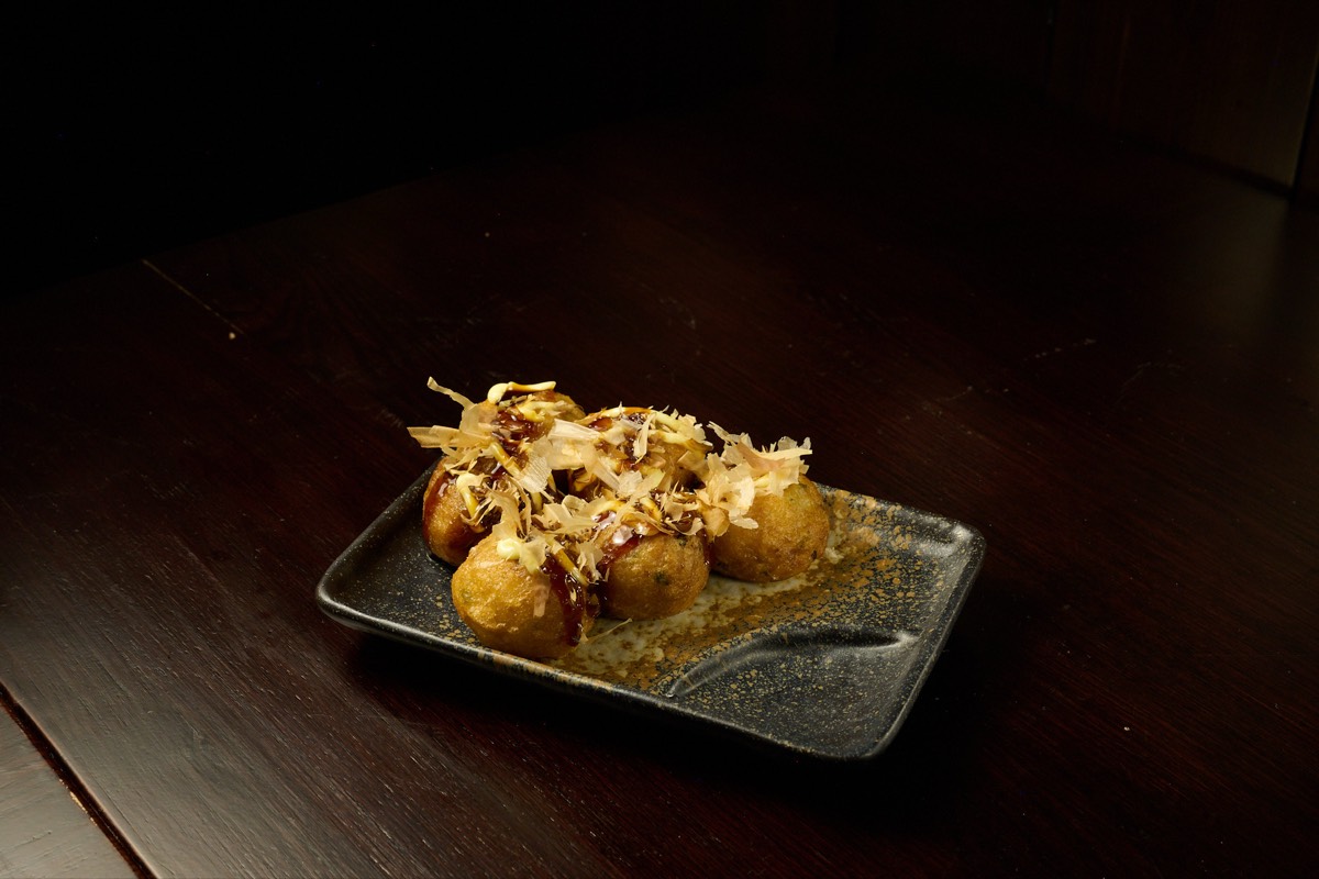 Close-up of steaming tonkotsu ramen with rich pork broth and perfect soft-boiled egg at Showa Era NYC