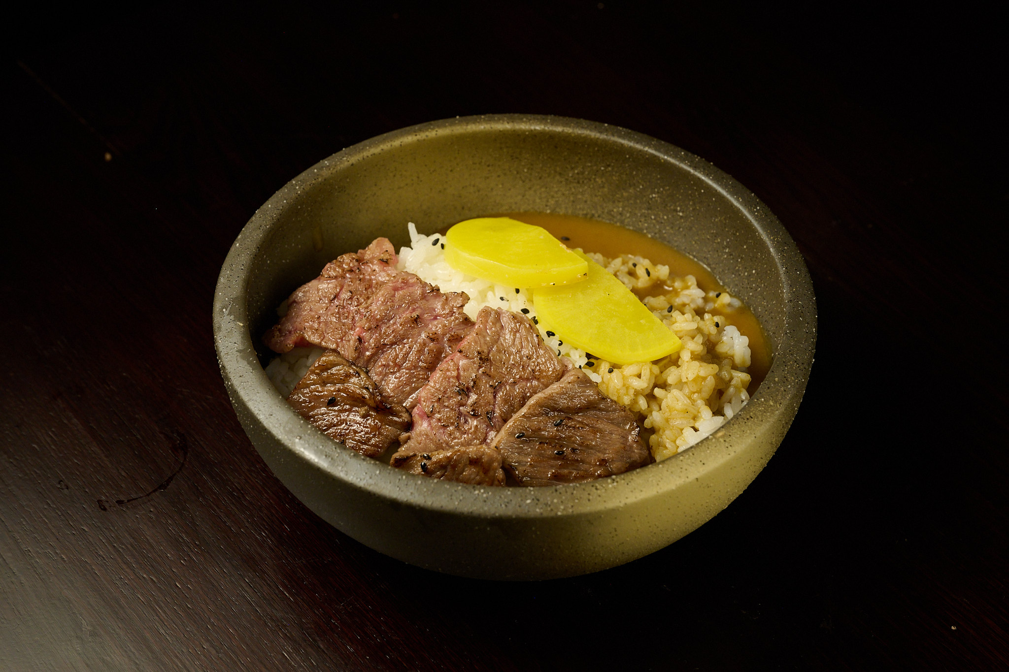 Premium wagyu beef don with pickled ginger on steamed rice at NYC Japanese izakaya