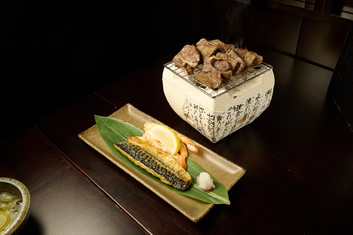 Grilled mackerel and wagyu beef on charcoal hibachi at Showa Era NYC