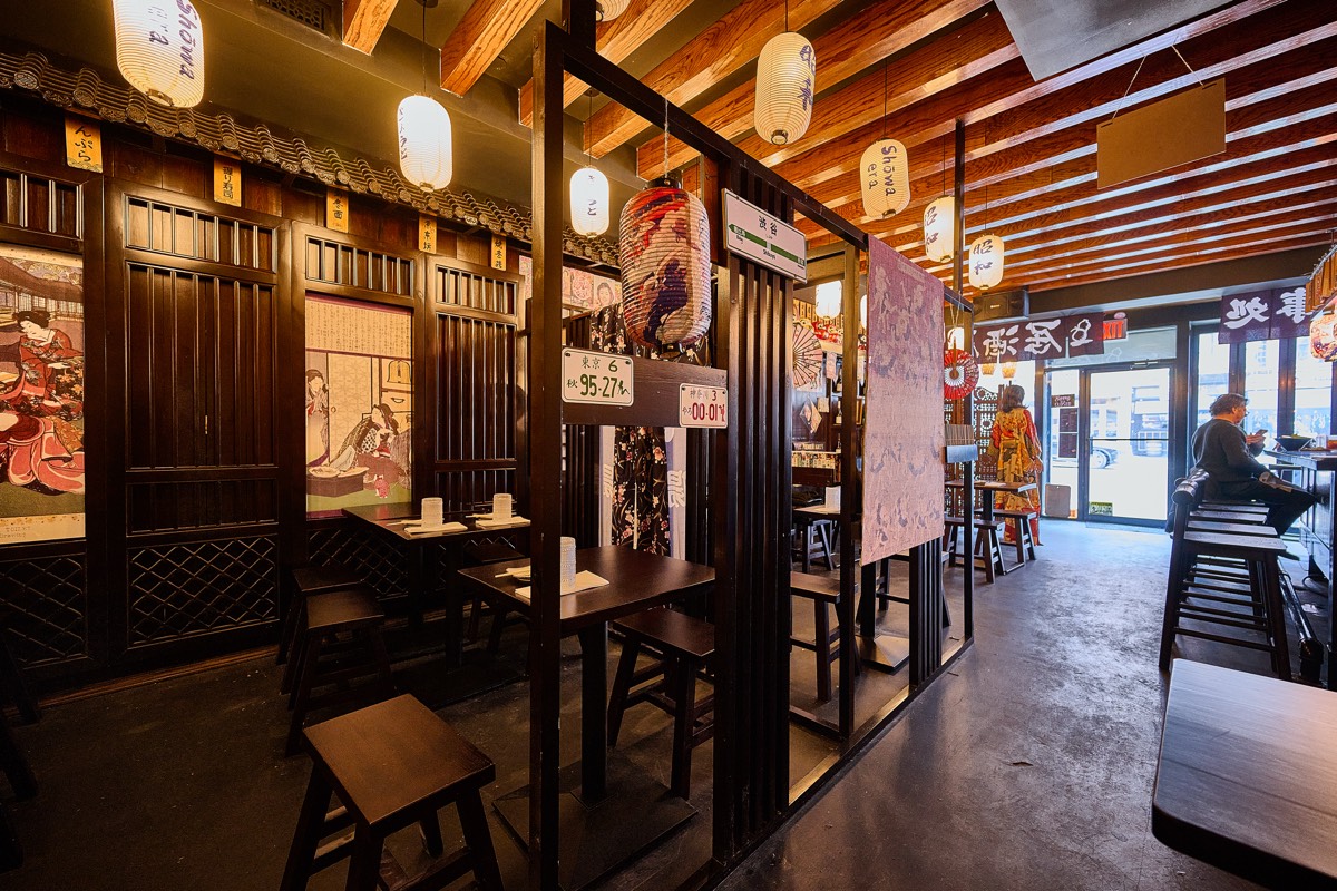 Showa-era style bar counter with warm lighting at NYC Japanese izakaya