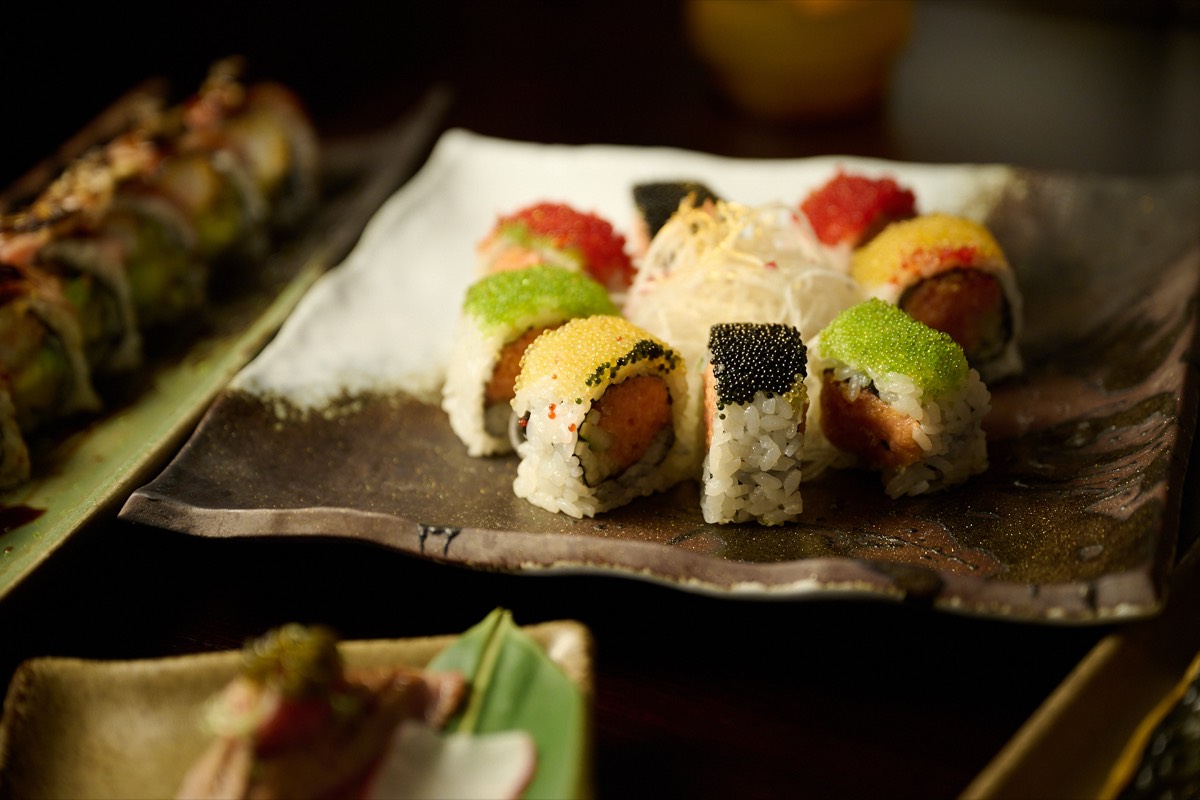 Tobiko-covered sushi roll with colorful fish roe at NYC Japanese izakaya