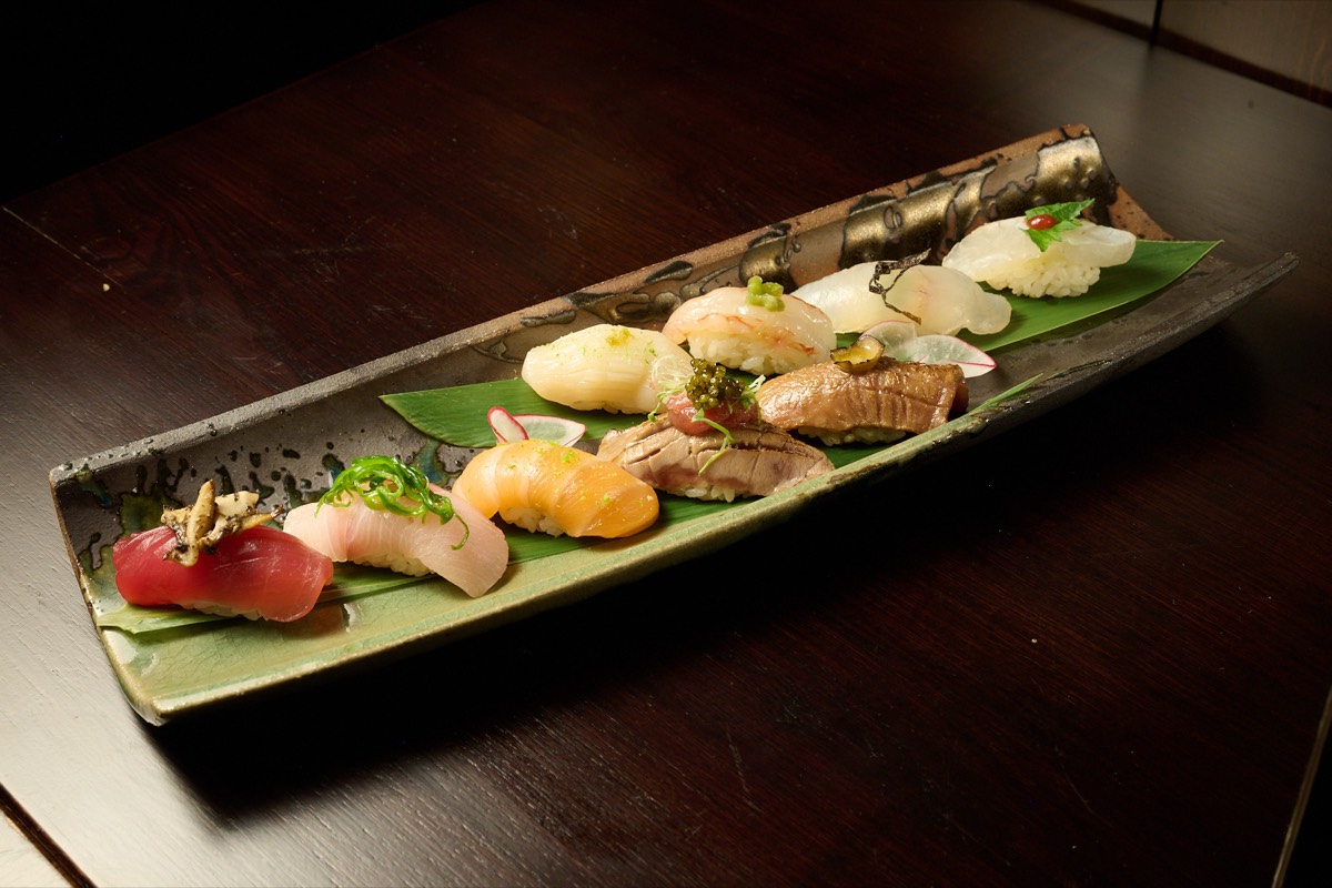 Premium wagyu steak seared on charcoal grill at NYC Japanese restaurant